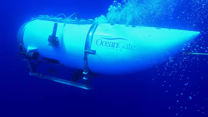 OceanGate submersible underwater with rising bubbles, related to CEO’s wife’s chilling reaction at implosion moment. OceanGate submersible underwater with rising bubbles, related to CEO’s wife’s chilling reaction at implosion moment.