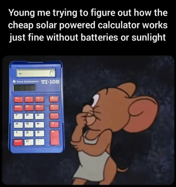Young cartoon mouse puzzled by a solar powered calculator, evoking nostalgia for the good old days.