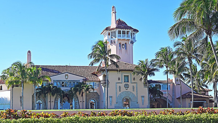 Mar-a-Lago estate exterior with palm trees and clear blue sky, related to plastic surgeons revealing Mar-a-Lago face secrets. Mar-a-Lago estate exterior with palm trees and clear blue sky, related to plastic surgeons revealing Mar-a-Lago face secrets.