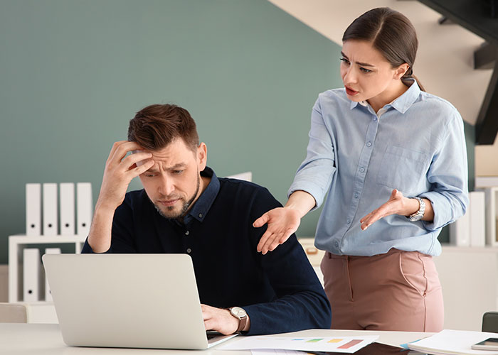 Frustrated worker and concerned woman arguing in office about late pay and audacity of boss after showing new truck. Frustrated worker and concerned woman arguing in office about late pay and audacity of boss after showing new truck.