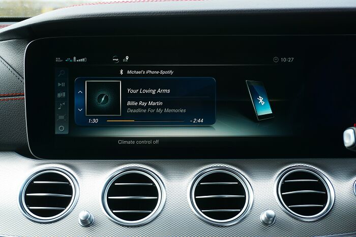 Car infotainment screen displaying song playing via Bluetooth, related to lost in translation scrambled hits quiz. Car infotainment screen displaying song playing via Bluetooth, related to lost in translation scrambled hits quiz.