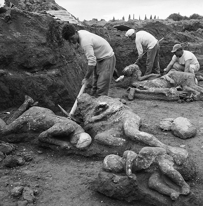 Archaeologists uncover Pompeii casts showing parents' tragic attempt to shield child during volcanic eruption. Archaeologists uncover Pompeii casts showing parents' tragic attempt to shield child during volcanic eruption.