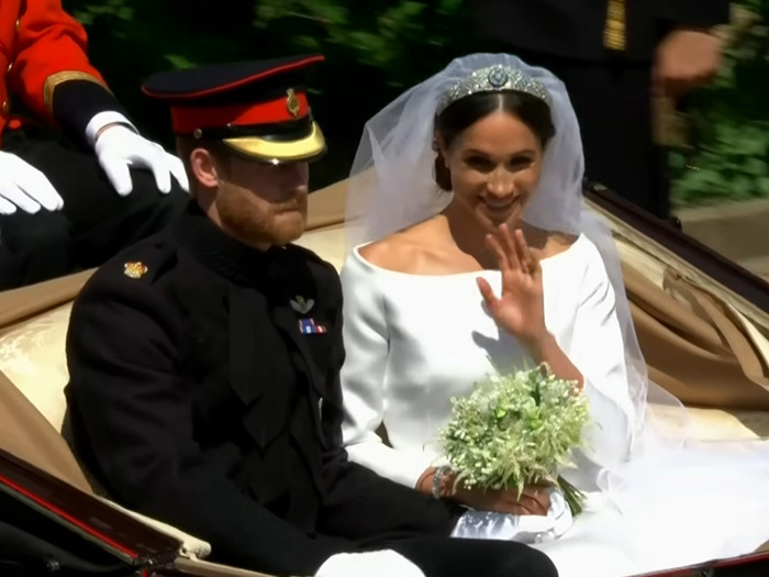 Meghan Markle in wedding dress with Prince Harry, her royal wedding and alleged caterer conflict involving Queen Elizabeth intervention Meghan Markle in wedding dress with Prince Harry, her royal wedding and alleged caterer conflict involving Queen Elizabeth intervention