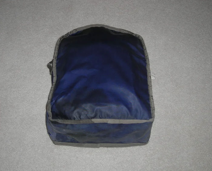 Soft navy blue fabric item on a gray surface representing risks people took with no logical reason at all.