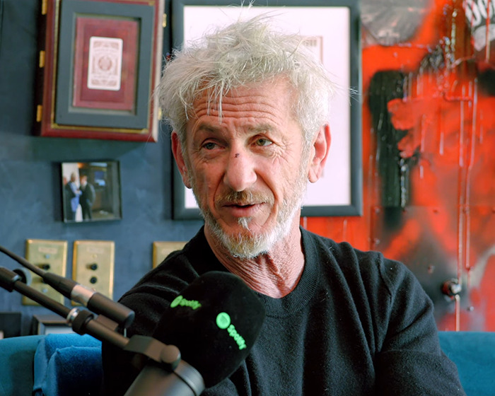 Sean Penn with a rough appearance speaking into a podcast microphone discussing his heavy claims about Woody Allen. Sean Penn with a rough appearance speaking into a podcast microphone discussing his heavy claims about Woody Allen.