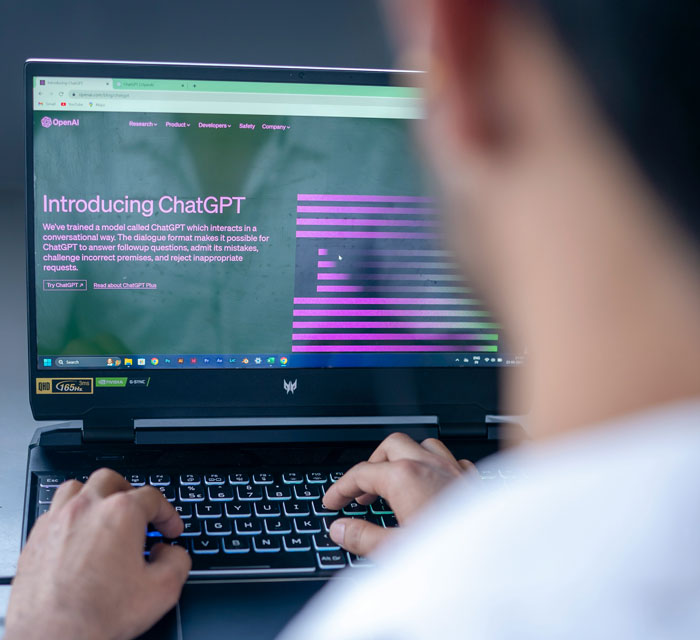 Person typing on a laptop displaying ChatGPT introduction page related to 2025 summer reading list and book existence issues. Person typing on a laptop displaying ChatGPT introduction page related to 2025 summer reading list and book existence issues.