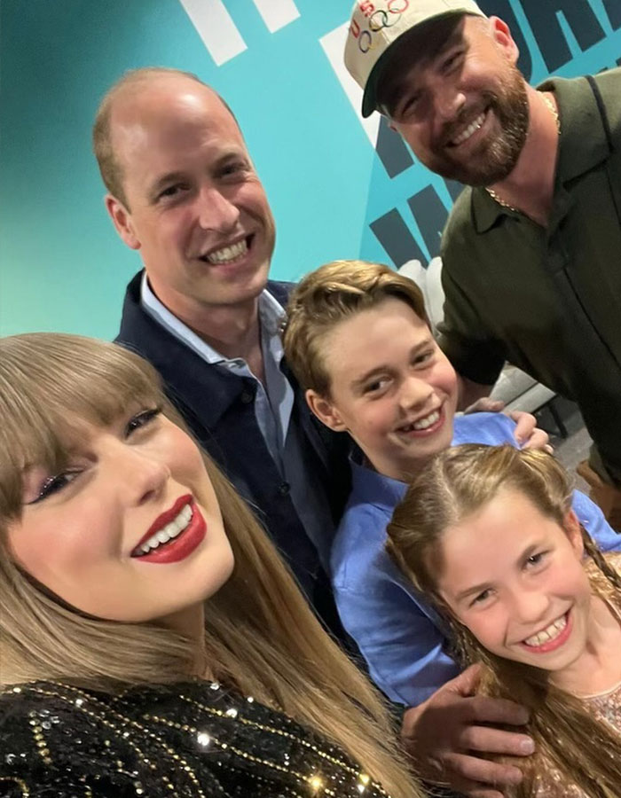 Taylor Swift smiling with a group of people, illustrating the topic of Trump claims about Taylor Swift being no longer hot. Taylor Swift smiling with a group of people, illustrating the topic of Trump claims about Taylor Swift being no longer hot.