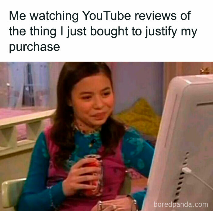 Woman watching YouTube reviews on computer, illustrating relatable moments in memes about the human experience.