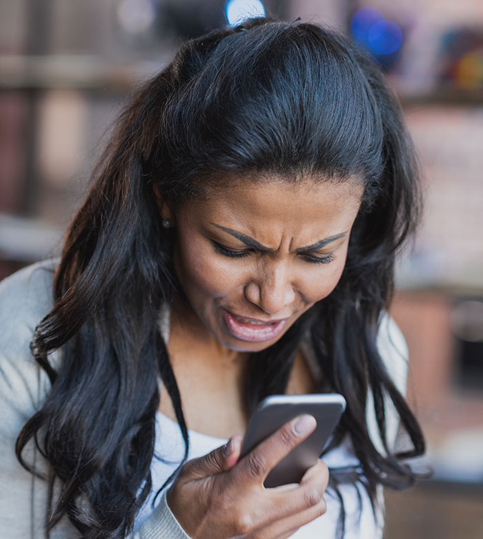 Woman transfers ex’s phone data and discovers cheating evidence while looking upset and shocked at the phone screen. Woman transfers ex’s phone data and discovers cheating evidence while looking upset and shocked at the phone screen.