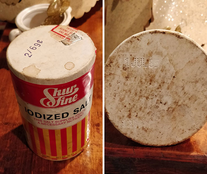 Vintage iodized salt container with paper lid found among bizarre things in old houses, showing signs of age and wear.