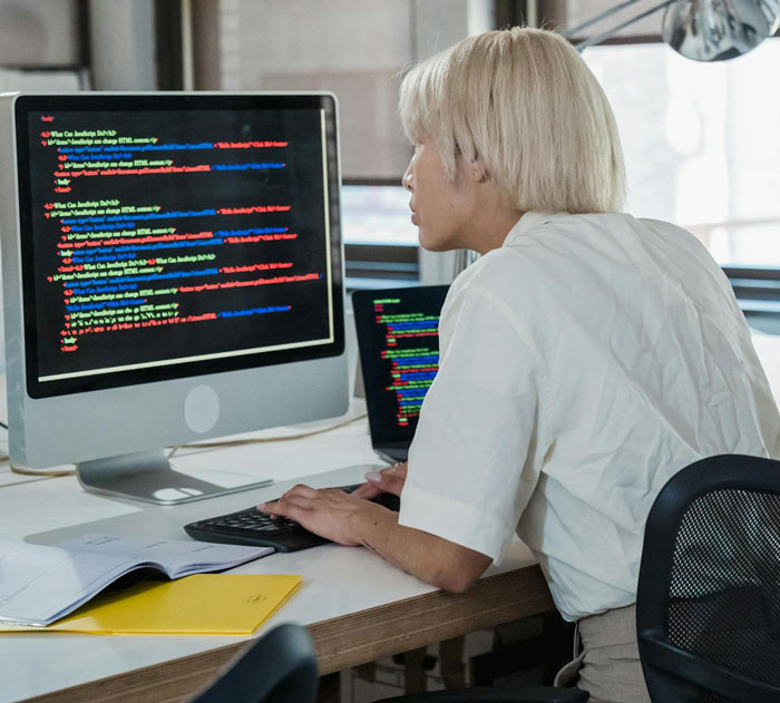 Person working on a coding interview task, realizing they got tricked during an interview while reviewing code on screen.
