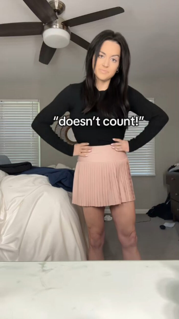 Woman posing confidently in a bedroom showing weight loss results using Ozempic with hands on hips Woman posing confidently in a bedroom showing weight loss results using Ozempic with hands on hips