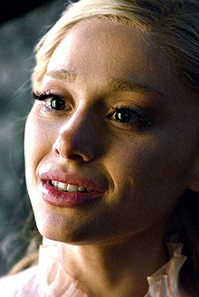 Close-up of Ariana Grande with a pale complexion and styled hair in a scene highlighting her entirely visible ribcage look. Close-up of Ariana Grande with a pale complexion and styled hair in a scene highlighting her entirely visible ribcage look.