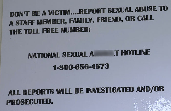 Sign urging victims to report sexual abuse with National Sexual Assault Hotline number, related to captive woman's brave cry for help. Sign urging victims to report sexual abuse with National Sexual Assault Hotline number, related to captive woman's brave cry for help.