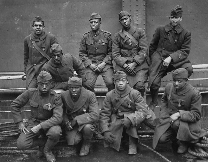 Group of African American soldiers in military uniforms, showcasing important moments in African American military history.