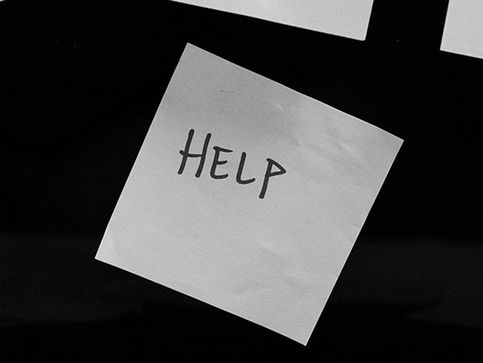 Sticky note with the word help written on it symbolizing captive woman's brave cry for help in Jersey Mike's restroom. Sticky note with the word help written on it symbolizing captive woman's brave cry for help in Jersey Mike's restroom.