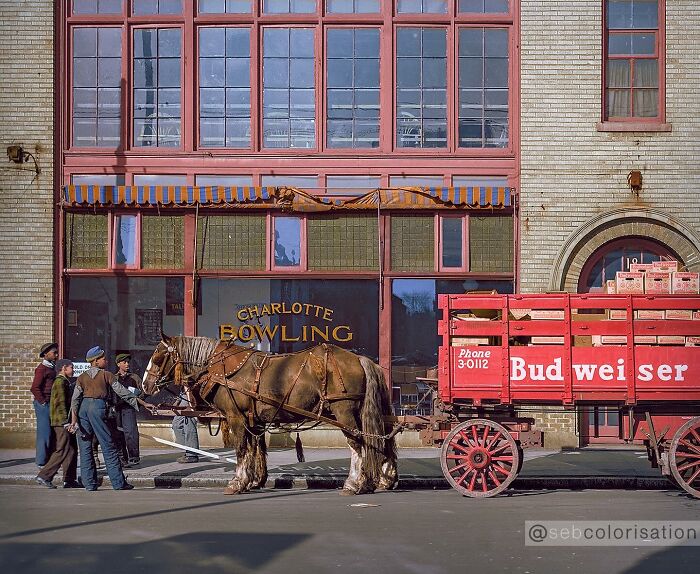 Colorized historical photo of a Budweiser horse-drawn wagon and children outside Charlotte Bowling alley.