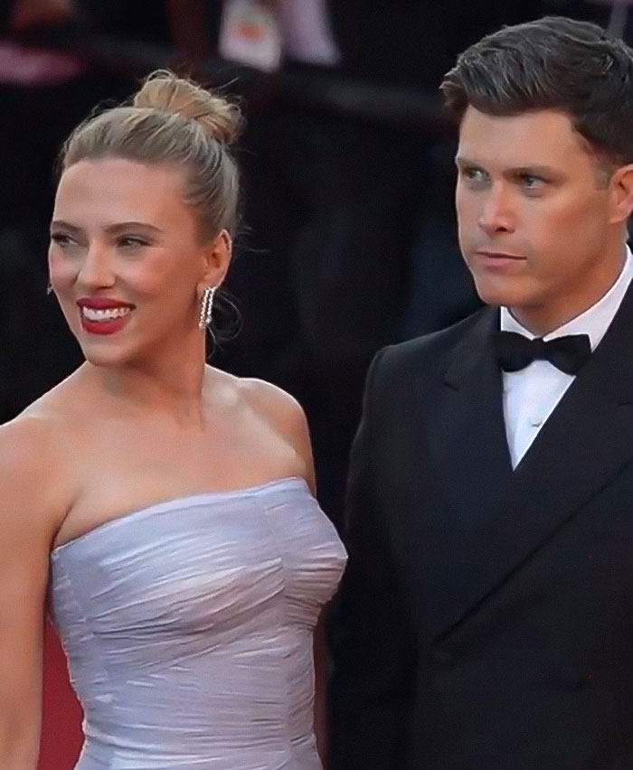 Scarlett Johansson wearing elegant dress with costar in tuxedo at premiere, stunning fans with unexpected kiss on lips. Scarlett Johansson wearing elegant dress with costar in tuxedo at premiere, stunning fans with unexpected kiss on lips.
