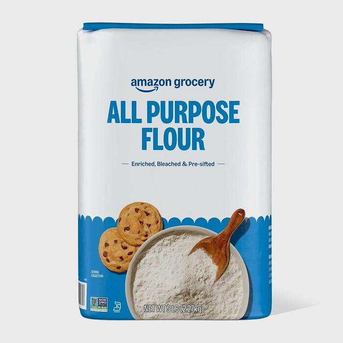 Amazon Fresh all purpose flour package with wooden spoon and cookies, showcasing affordable grocery staples.