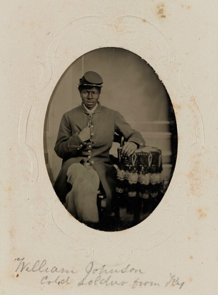 African American soldier from the Civil War era seated in uniform, representing important military history facts.