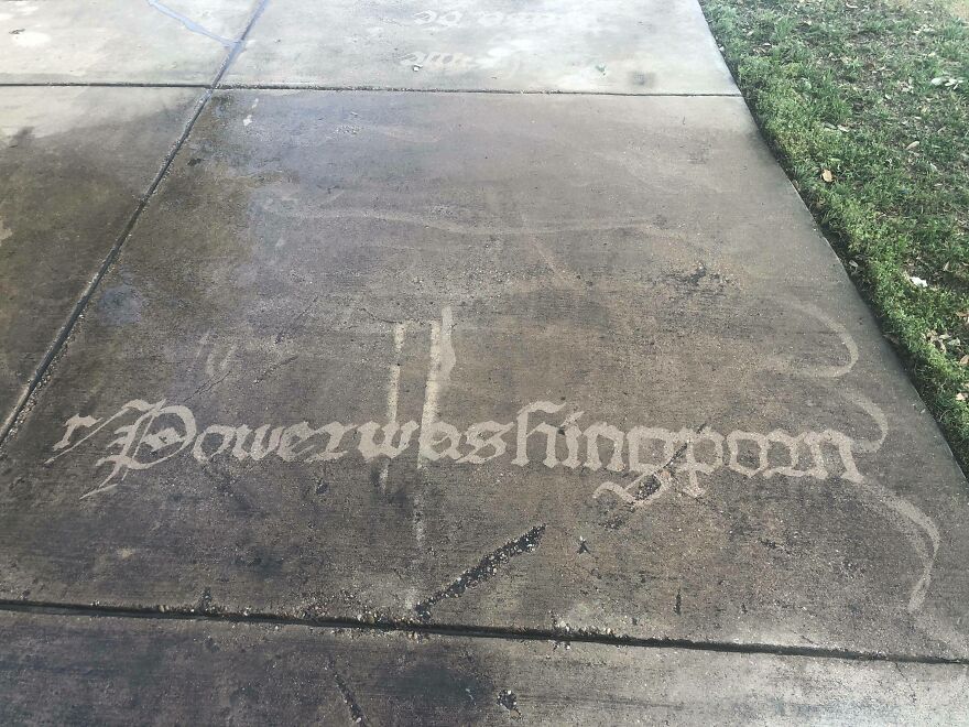 Faded sidewalk art showcasing perfect handwriting examples with intricate calligraphy style on concrete pavement.