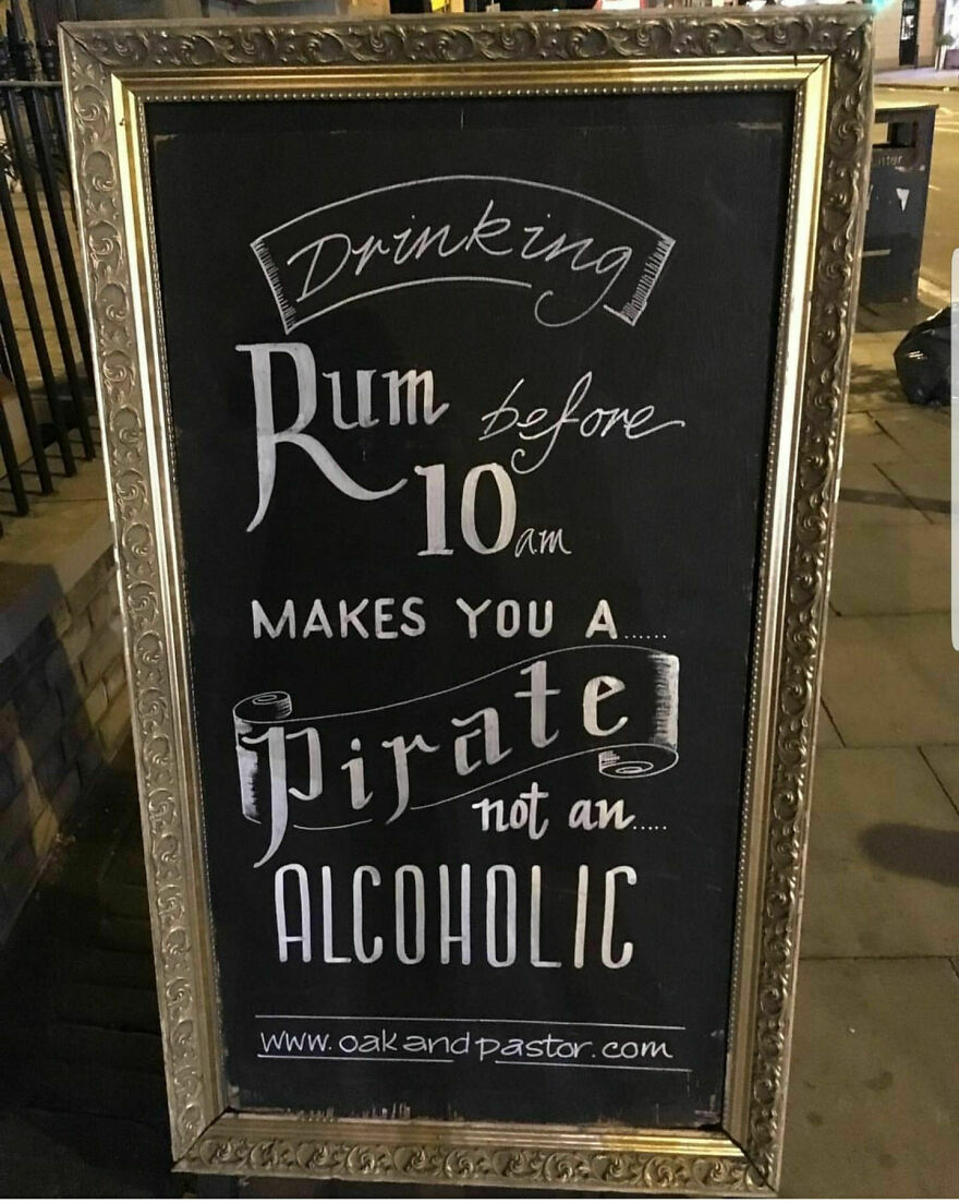 Chalkboard sign with perfect handwriting example stating rum before 10 am makes you a pirate not an alcoholic.