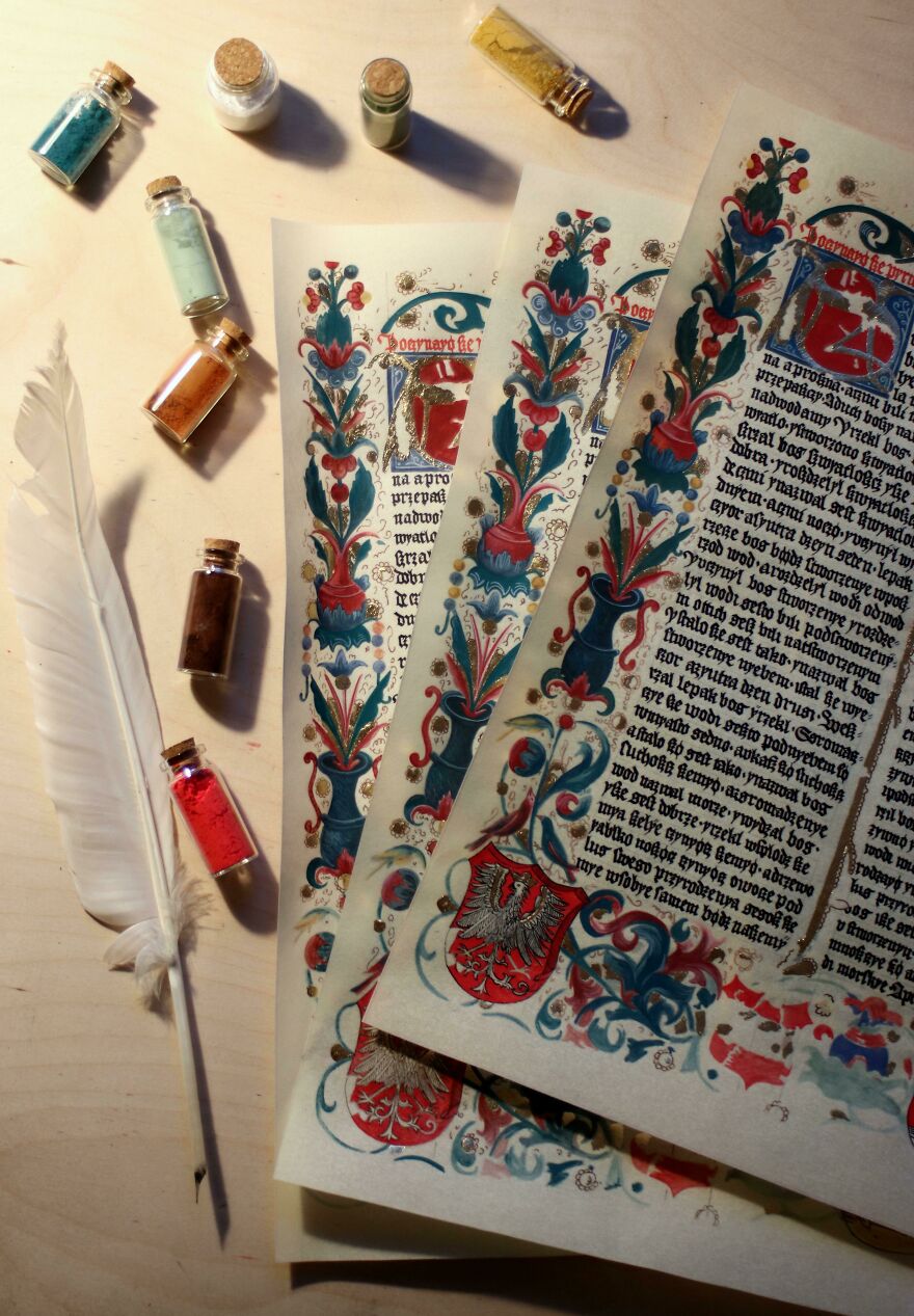 Medieval illuminated manuscripts with perfect handwriting examples, colorful inks, and a white quill on a wooden surface.