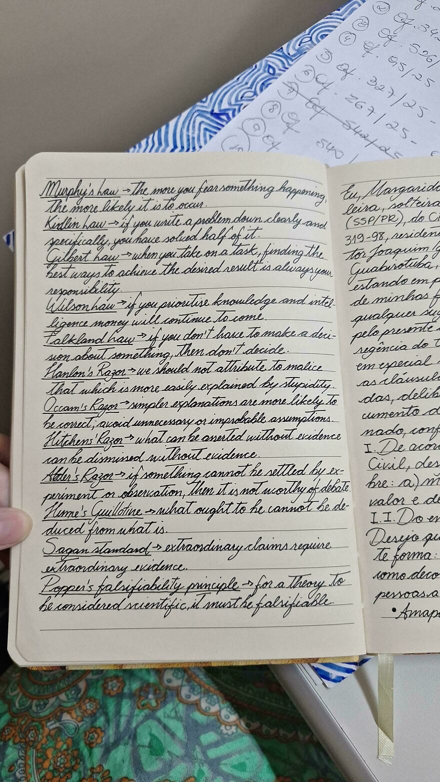 Notebook open to pages filled with perfect handwriting examples, showcasing clear and elegant cursive writing style.