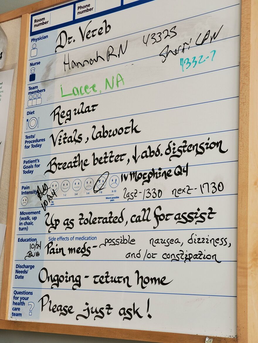 Handwriting example on a hospital whiteboard showing neat, artistic text with clear patient care instructions and notes.