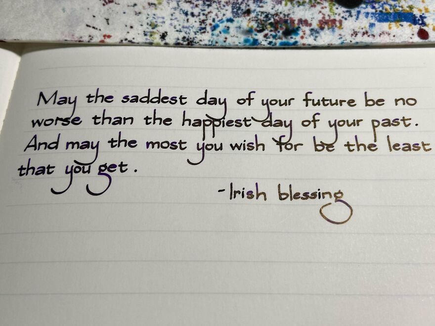 Handwritten Irish blessing penned with perfect handwriting example on lined paper, showcasing neat and artistic script style.