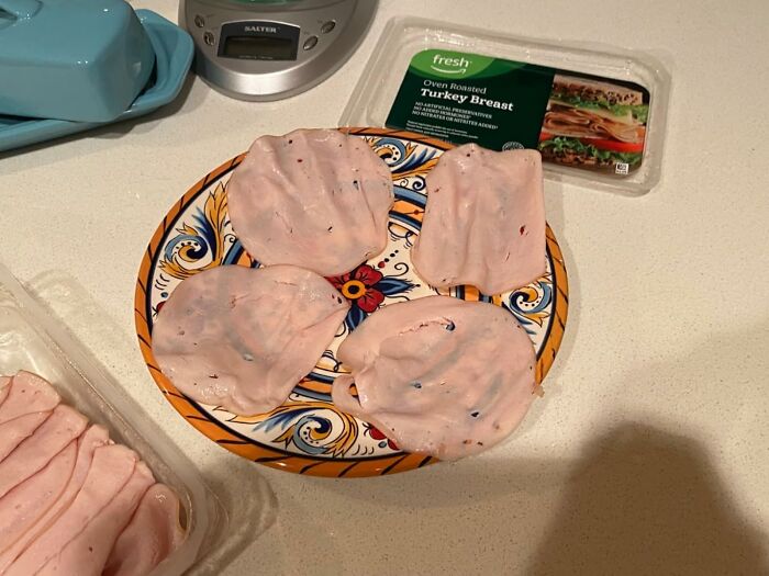 Amazon Fresh oven roasted turkey breast slices on a plate showing fresh staples cheaper than big box stores.