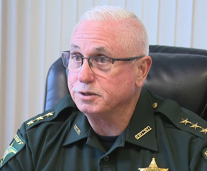 Law enforcement officer in uniform discussing captive woman’s brave cry for help hidden in Jersey Mike’s subs restroom. Law enforcement officer in uniform discussing captive woman’s brave cry for help hidden in Jersey Mike’s subs restroom.
