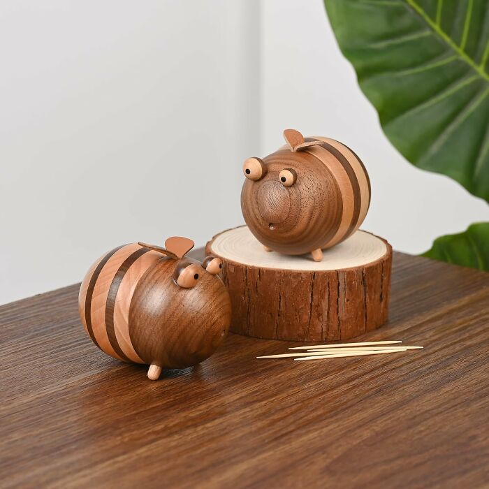 Wooden kitchen items designed as cute animal toothpick holders on a table, showcasing best-selling kitchen items.