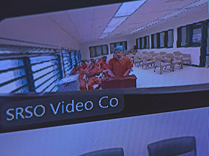Surveillance footage showing captive woman in orange jumpsuit during rescue after brave cry for help at Jersey Mike's restroom. Surveillance footage showing captive woman in orange jumpsuit during rescue after brave cry for help at Jersey Mike's restroom.