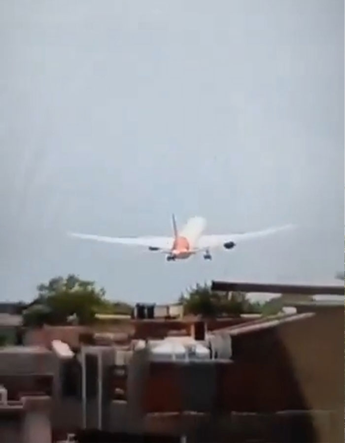 Plane approaching unusually low over buildings during take-off, prompting expert suggesting evil intent after crash. Plane approaching unusually low over buildings during take-off, prompting expert suggesting evil intent after crash.