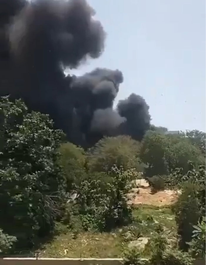 Thick black smoke rising above trees after Air India crash, with expert theory on simple mistake causing the tragedy. Thick black smoke rising above trees after Air India crash, with expert theory on simple mistake causing the tragedy.
