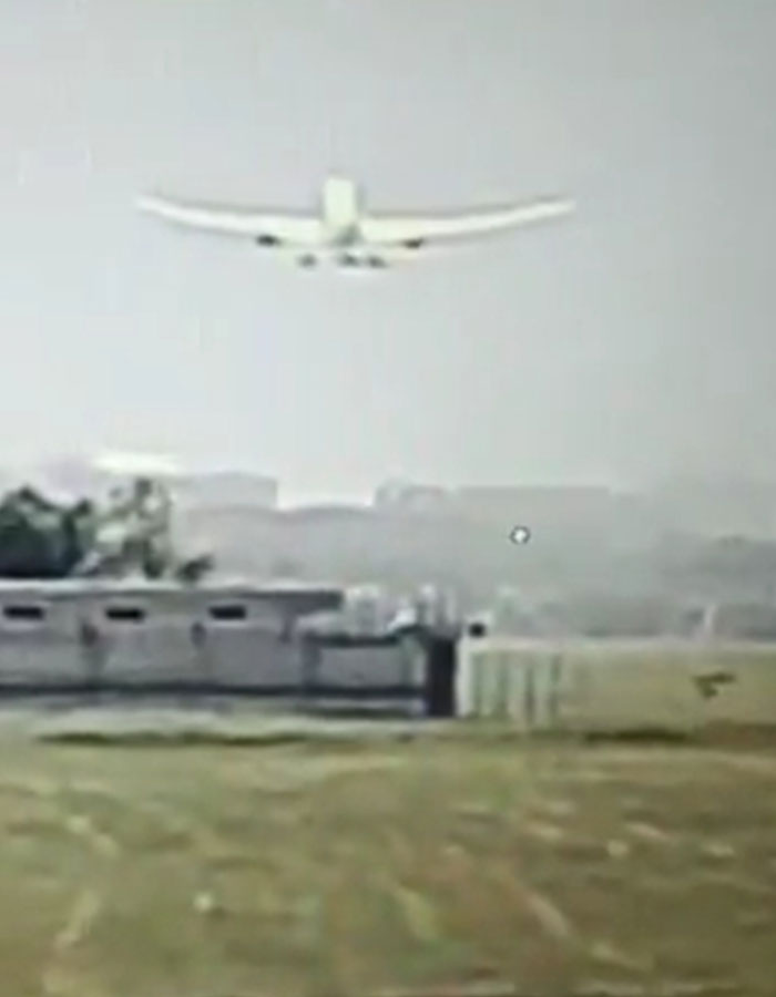 Small airplane flying low over an open field, linked to expert theory on simple mistake in Air India crash. Small airplane flying low over an open field, linked to expert theory on simple mistake in Air India crash.