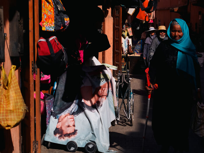 Colorful street scene captured by photographer traveling the world, showing candid moments full of emotion in a busy market.