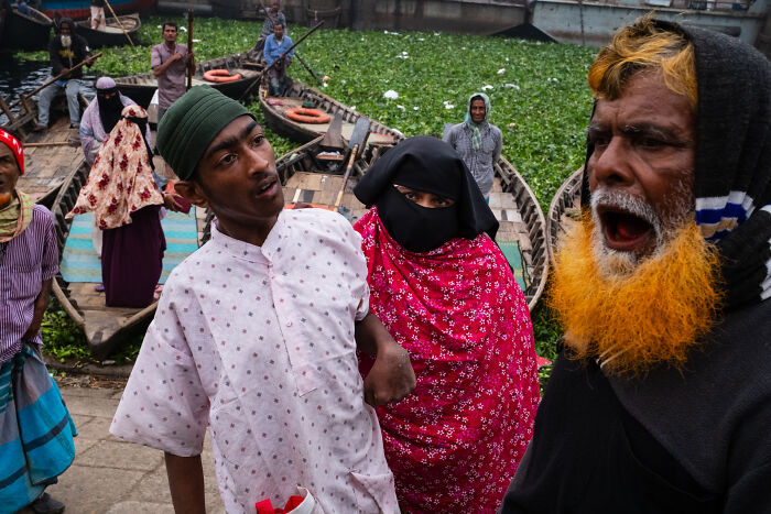 Candid street moments captured by photographer showing diverse people with expressive emotions near boats on a waterway.