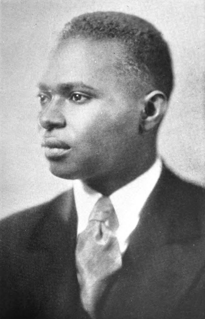 Portrait of a man in a suit and tie, representing a crucial moment that defined the Harlem Renaissance era.
