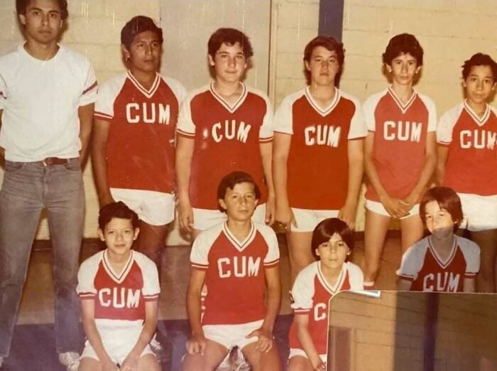 Vintage group photo of a youth sports team wearing retro red uniforms, illustrating unusual moments from history.
