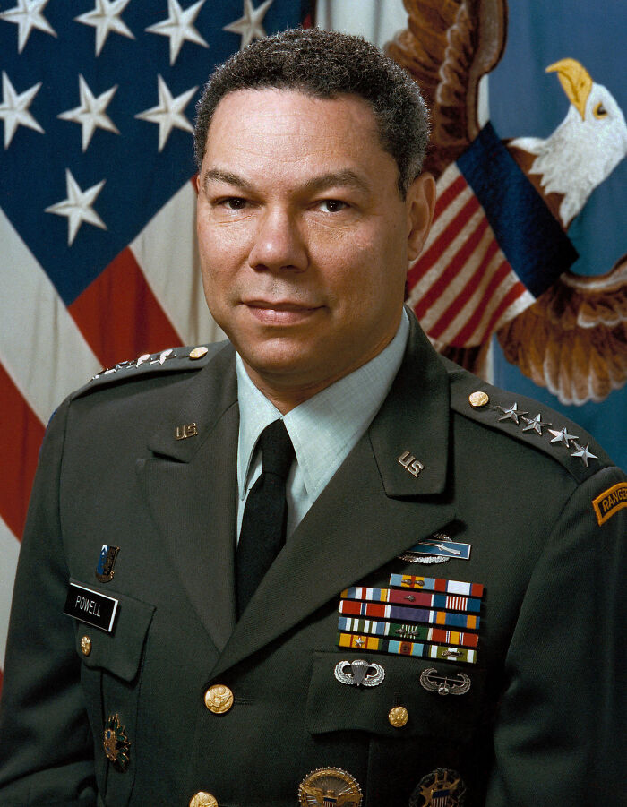 Portrait of a high-ranking African American military officer wearing uniform with medals and badges representing military history.