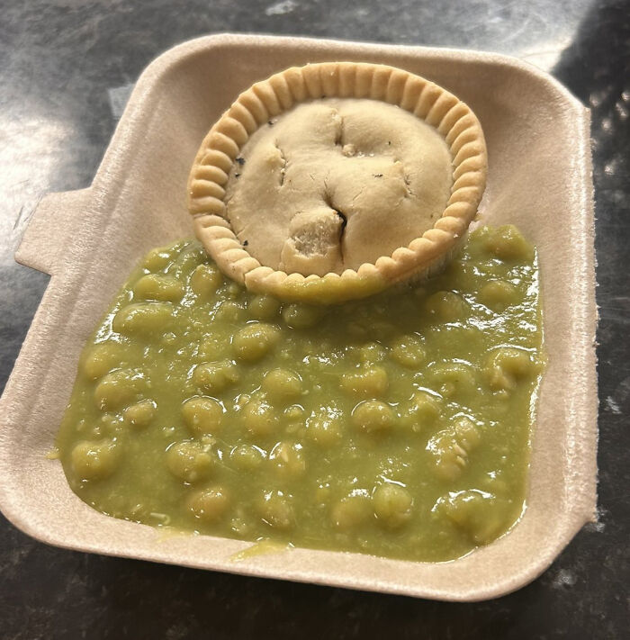 Traditional British pie served with mushy peas on a tray, illustrating European netizens correcting common country facts.