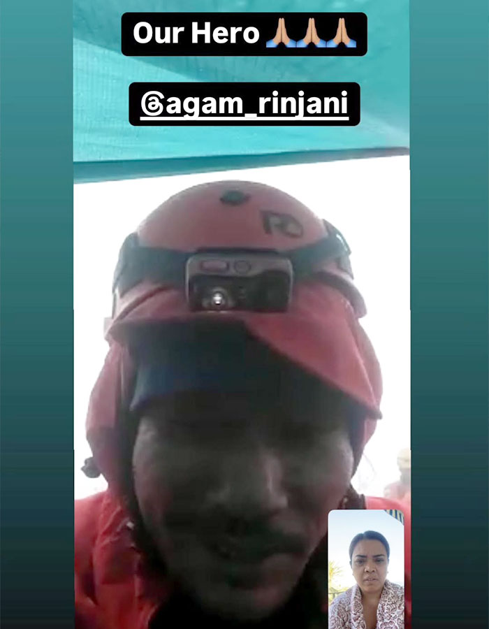 Rescue guide in helmet recovering tourist's body from 1600ft-deep active volcano during video call. Rescue guide in helmet recovering tourist's body from 1600ft-deep active volcano during video call.