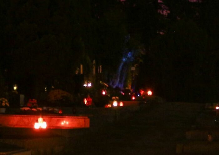 Took A Photo Of A Cemetery, Then Zoomed In... Well That Blue Thing Seems To Have A Face