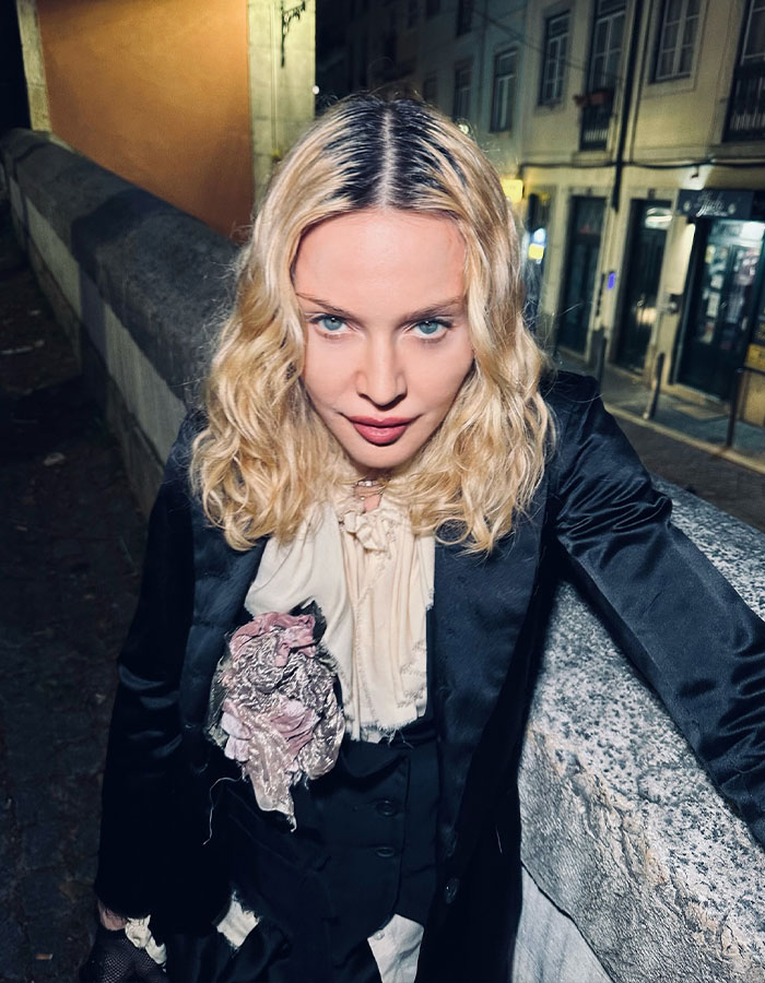 Madonna posing outdoors at night in a black outfit, relating to Madonna blasted by Hamilton star for disrespectful behavior. Madonna posing outdoors at night in a black outfit, relating to Madonna blasted by Hamilton star for disrespectful behavior.