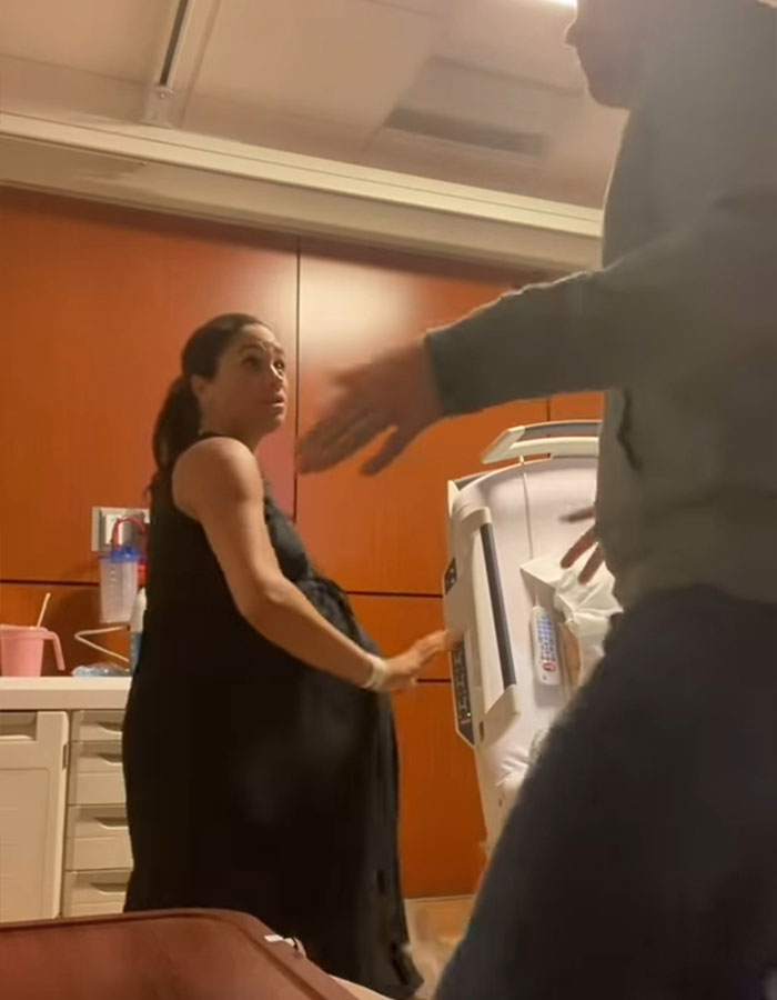 Pregnant woman in black dress in a hospital room, related to Meghan Markle's mastermind plan viral pregnancy twerk video. Pregnant woman in black dress in a hospital room, related to Meghan Markle's mastermind plan viral pregnancy twerk video.