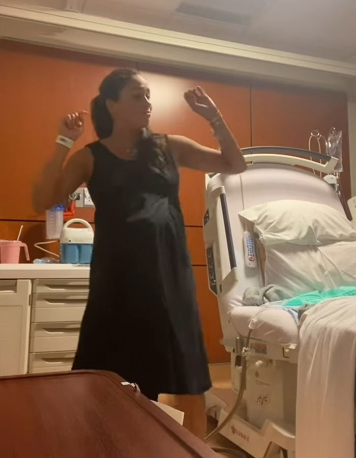 Pregnant woman dancing in hospital room, highlighting Meghan Markle's viral pregnancy twerk video mastermind plan. Pregnant woman dancing in hospital room, highlighting Meghan Markle's viral pregnancy twerk video mastermind plan.