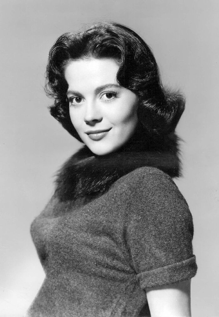 Black and white portrait of a young woman with curled hair, dressed in vintage attire, representing stars lost too soon.