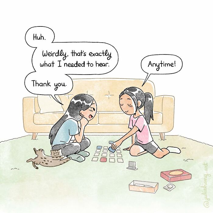 Two girls sitting on the floor playing a card game, reflecting on moving stories capturing the ups and downs of life.